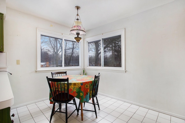 dining space with a healthy amount of sunlight and light tile patterned floors