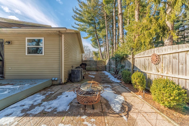 view of patio featuring an outdoor fire pit and central air condition unit