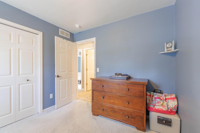 bedroom featuring light colored carpet