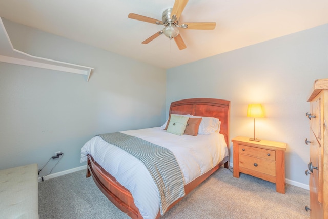 bedroom with ceiling fan and light carpet