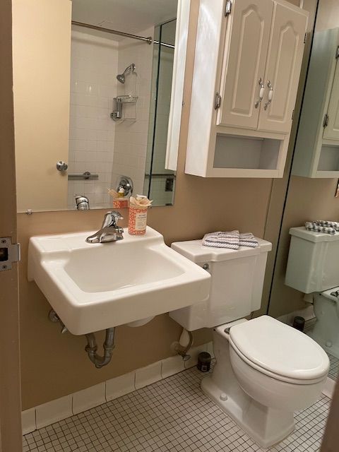 bathroom with tile patterned floors, toilet, and sink