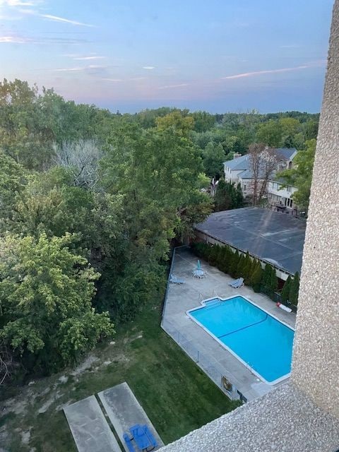 view of pool at dusk