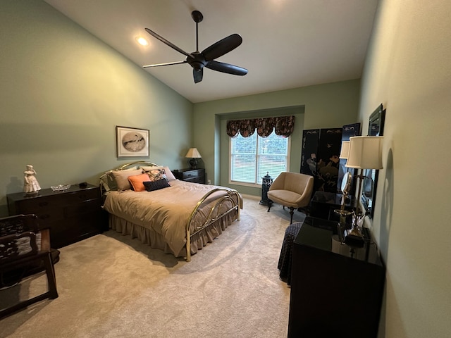 carpeted bedroom with ceiling fan and lofted ceiling