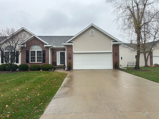 ranch-style house with a garage and a front lawn