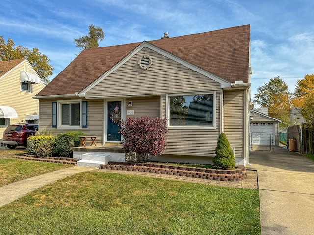 view of front of home featuring a garage, concrete driveway, a shingled roof, and a front yard