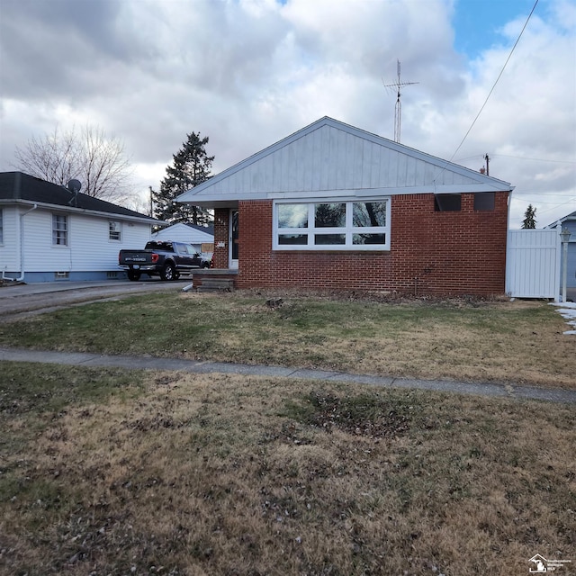 view of side of home featuring a lawn