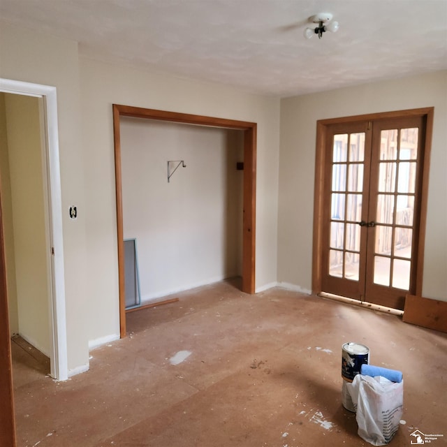 unfurnished bedroom featuring a closet and french doors