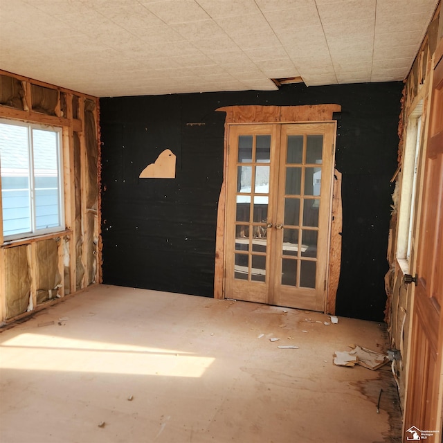 unfurnished room with french doors