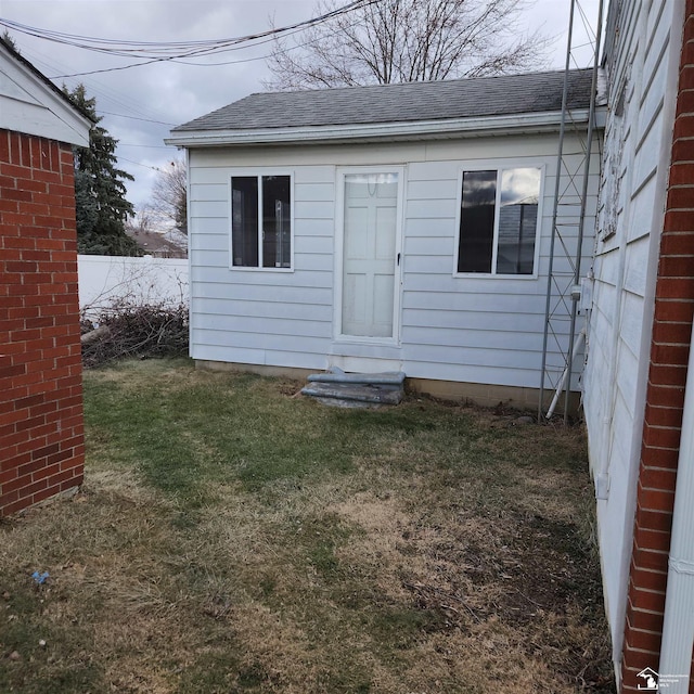 view of outbuilding featuring a yard