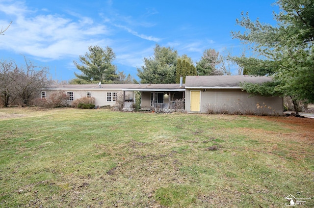 view of front of property with a front yard and a porch