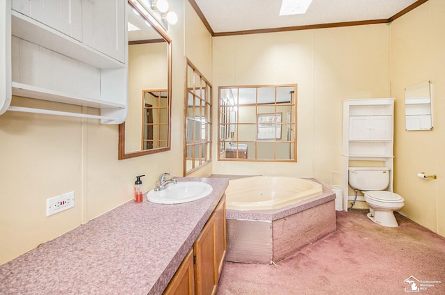 bathroom with crown molding, vanity, toilet, and a bathtub