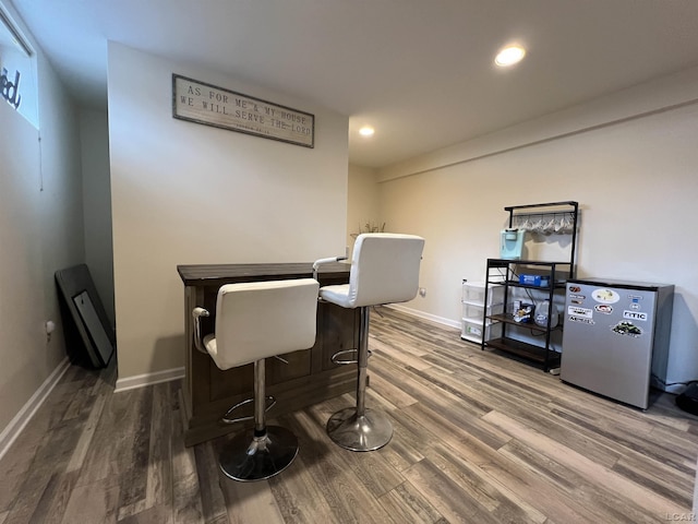 dining room with dark hardwood / wood-style floors