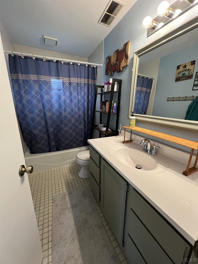 full bathroom featuring vanity, shower / tub combo, tile patterned floors, and toilet