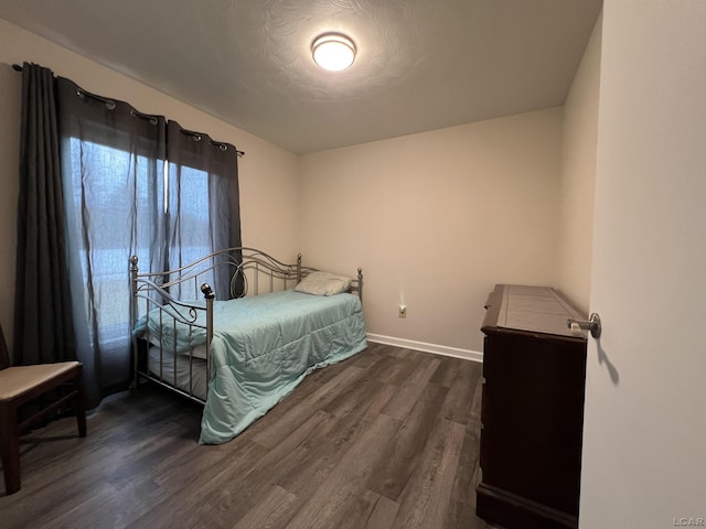 bedroom featuring dark hardwood / wood-style floors