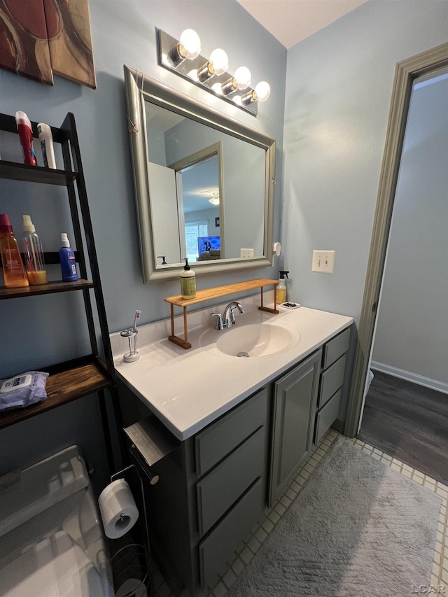 bathroom featuring tile patterned flooring and vanity