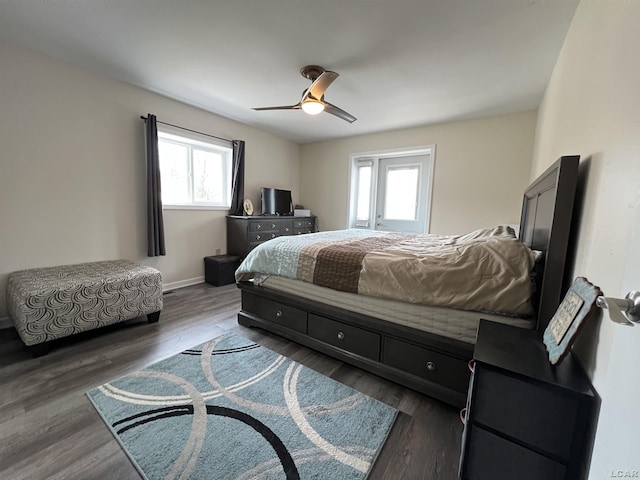 bedroom with ceiling fan and dark hardwood / wood-style flooring