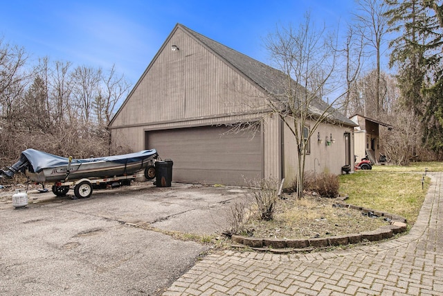 view of side of property featuring a garage