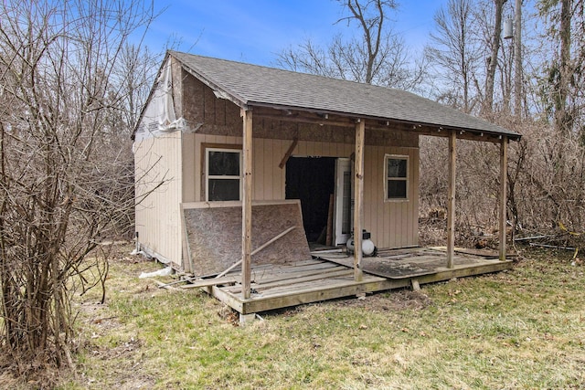 view of outbuilding featuring a lawn