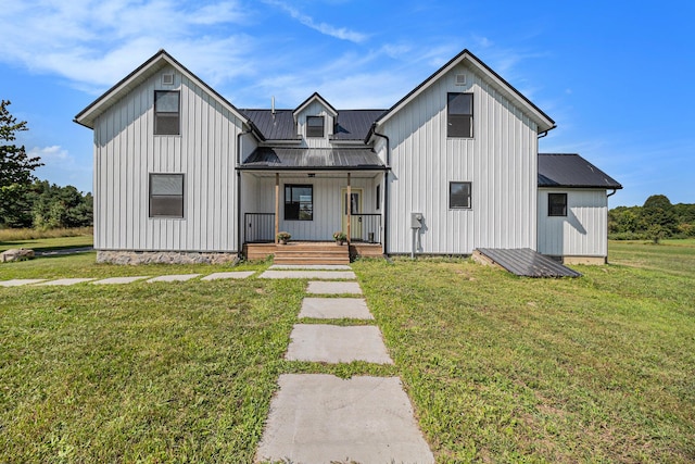 modern inspired farmhouse featuring a front yard and a porch