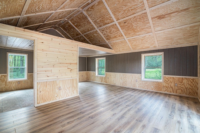 unfurnished room featuring hardwood / wood-style flooring and a wealth of natural light