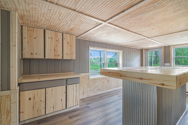 kitchen with a healthy amount of sunlight, light wood-type flooring, light brown cabinets, and butcher block countertops