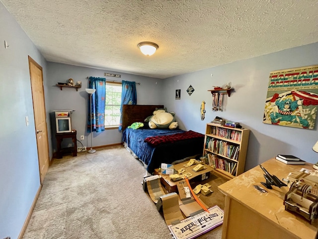 bedroom with light carpet and a textured ceiling