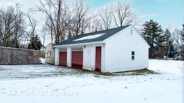 view of snow covered garage