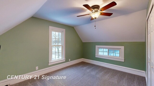 additional living space with lofted ceiling, ceiling fan, and carpet