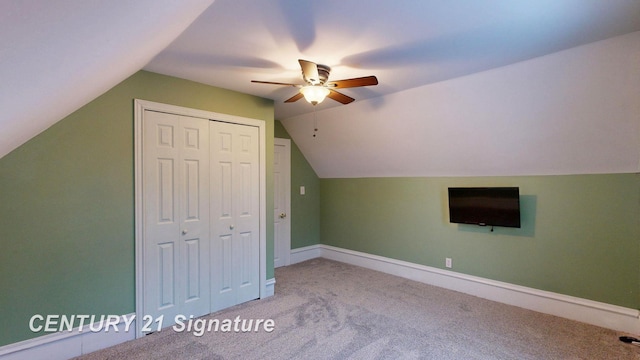 additional living space featuring vaulted ceiling, light carpet, and ceiling fan