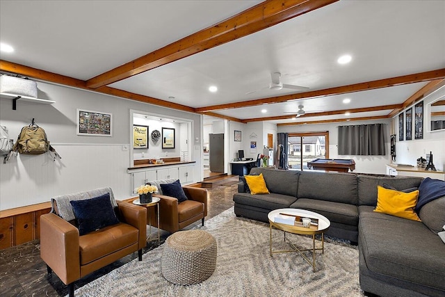 living room with beamed ceiling and ceiling fan