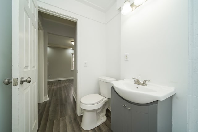 bathroom with vanity, hardwood / wood-style floors, and toilet