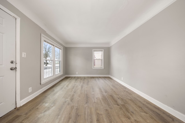 empty room with light hardwood / wood-style flooring