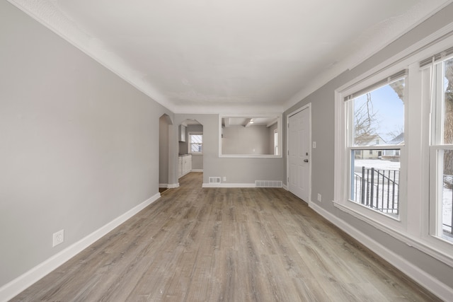 unfurnished living room with light hardwood / wood-style floors