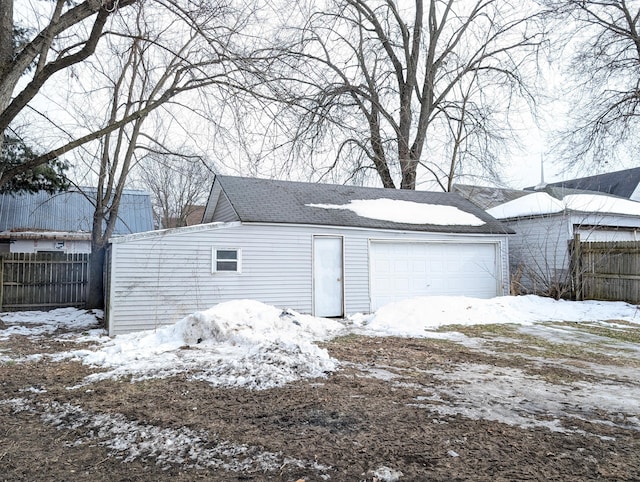 view of snow covered garage