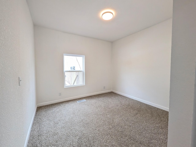 empty room featuring carpet floors