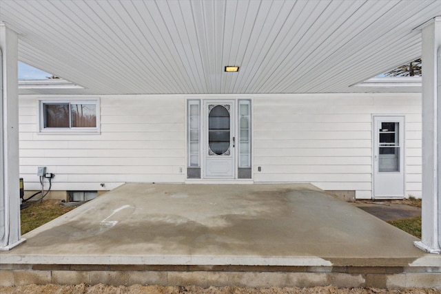 property entrance featuring a patio area