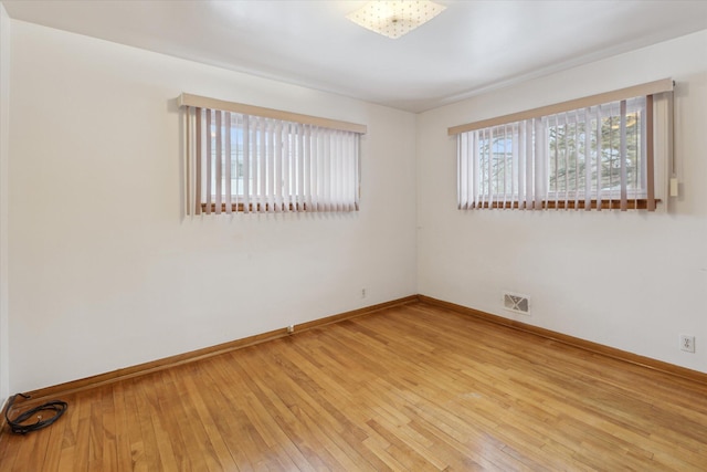 empty room featuring light hardwood / wood-style floors