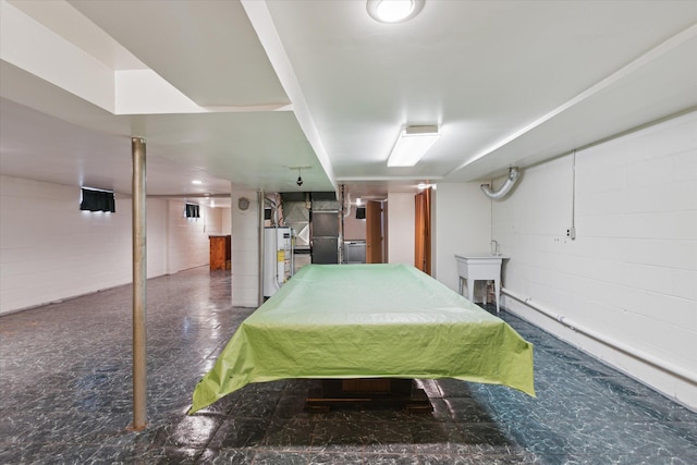 interior space with water heater, sink, and billiards