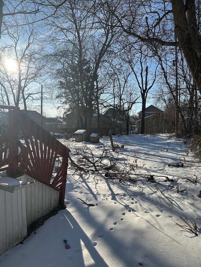 view of yard layered in snow