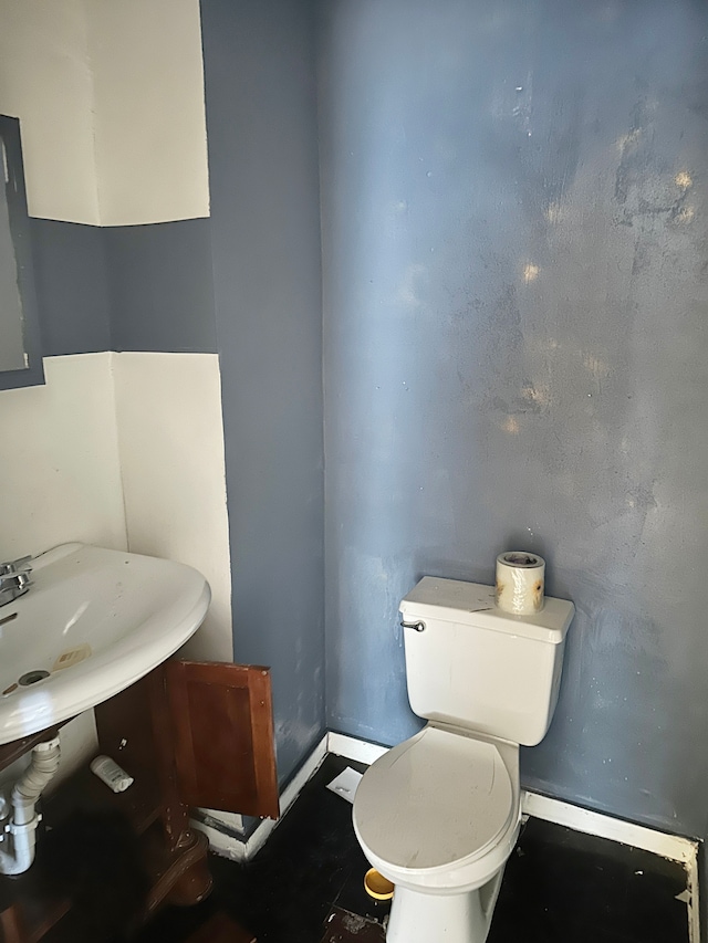 bathroom featuring sink and toilet