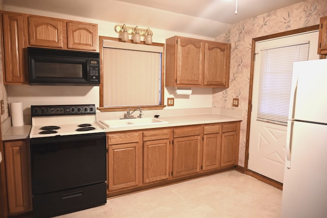 kitchen featuring white refrigerator, lofted ceiling, sink, and range with electric stovetop