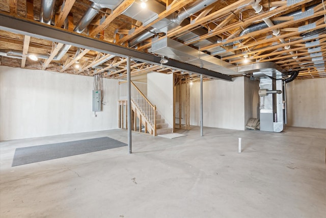 basement with heating unit and electric panel