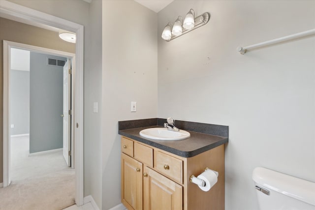 bathroom with vanity and toilet