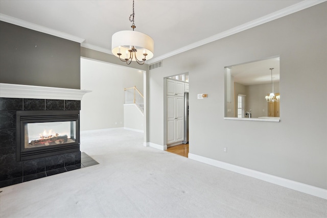 living room with crown molding, light colored carpet, a chandelier, and a multi sided fireplace