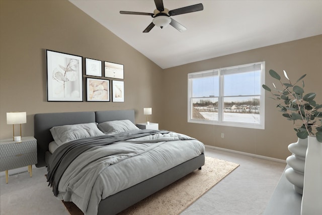 carpeted bedroom with vaulted ceiling and ceiling fan