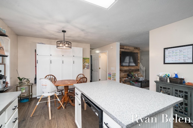 kitchen featuring white cabinetry, hanging light fixtures, black dishwasher, a kitchen island, and dark hardwood / wood-style flooring