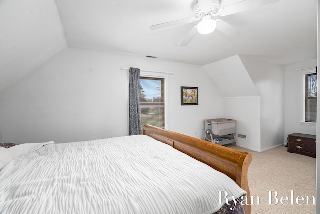 carpeted bedroom with lofted ceiling and ceiling fan