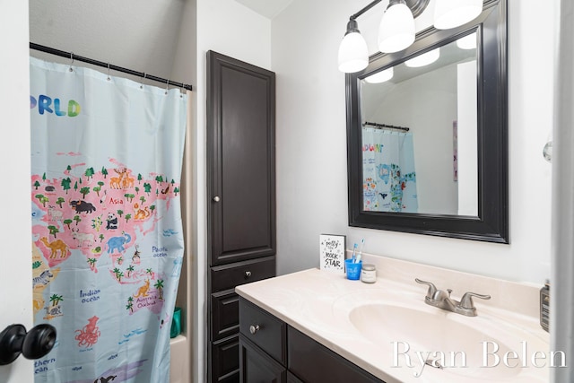 bathroom featuring vanity and shower / bath combo with shower curtain