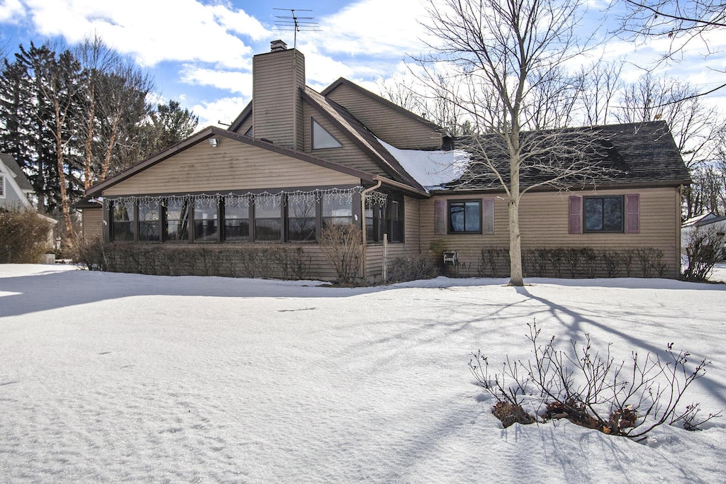 view of snow covered house