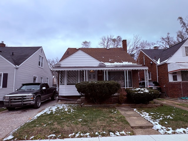 bungalow-style house with a front yard